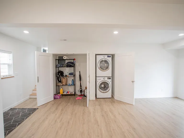 Lower Floor Family Room. Pantry storage and Laundry area shown.