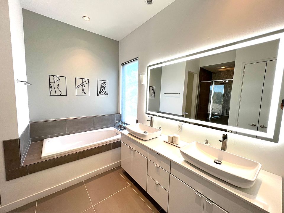 Double vanity, LED mirror, separate shower, and soaking tub will ensure there are no bathroom queues in the morning.