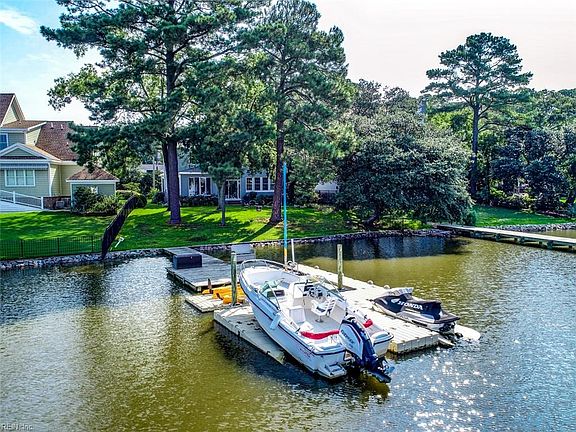 The boat dock offers a new EZ Dock floating boat lift, jet ski ramp and kayak launch.