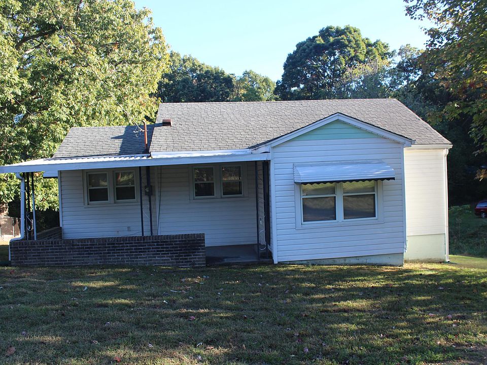 Front with covered patio/porch