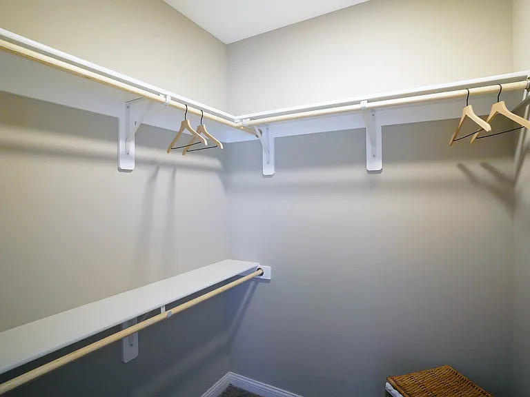 Storage that actually works for you _ walk-in closets with built-in shelves and double racks to keep things organized.