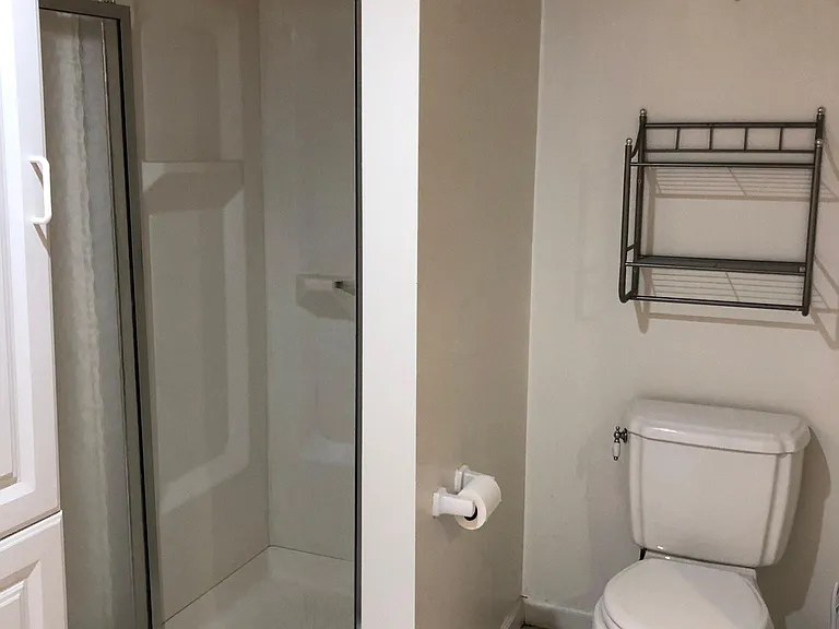 Bathroom with tile floor, stall shower