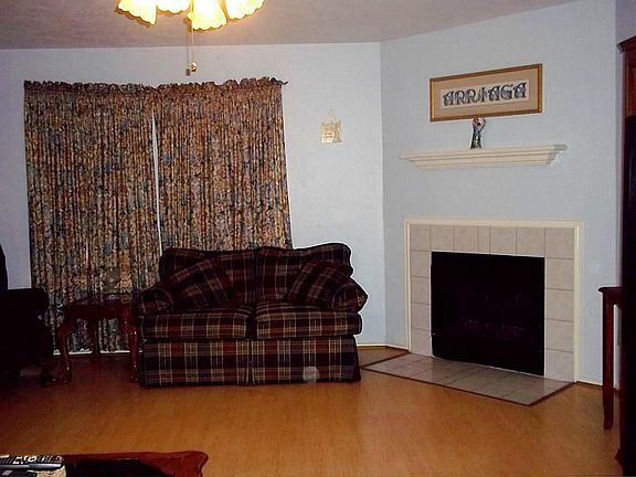 WOOD LAMINATE FLOORS IN FAMILY ROOM W/FIREPLACE