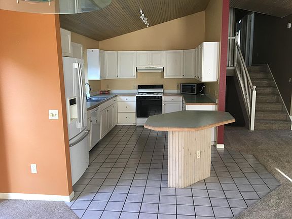 Kitchen with view of newly installed carpet.