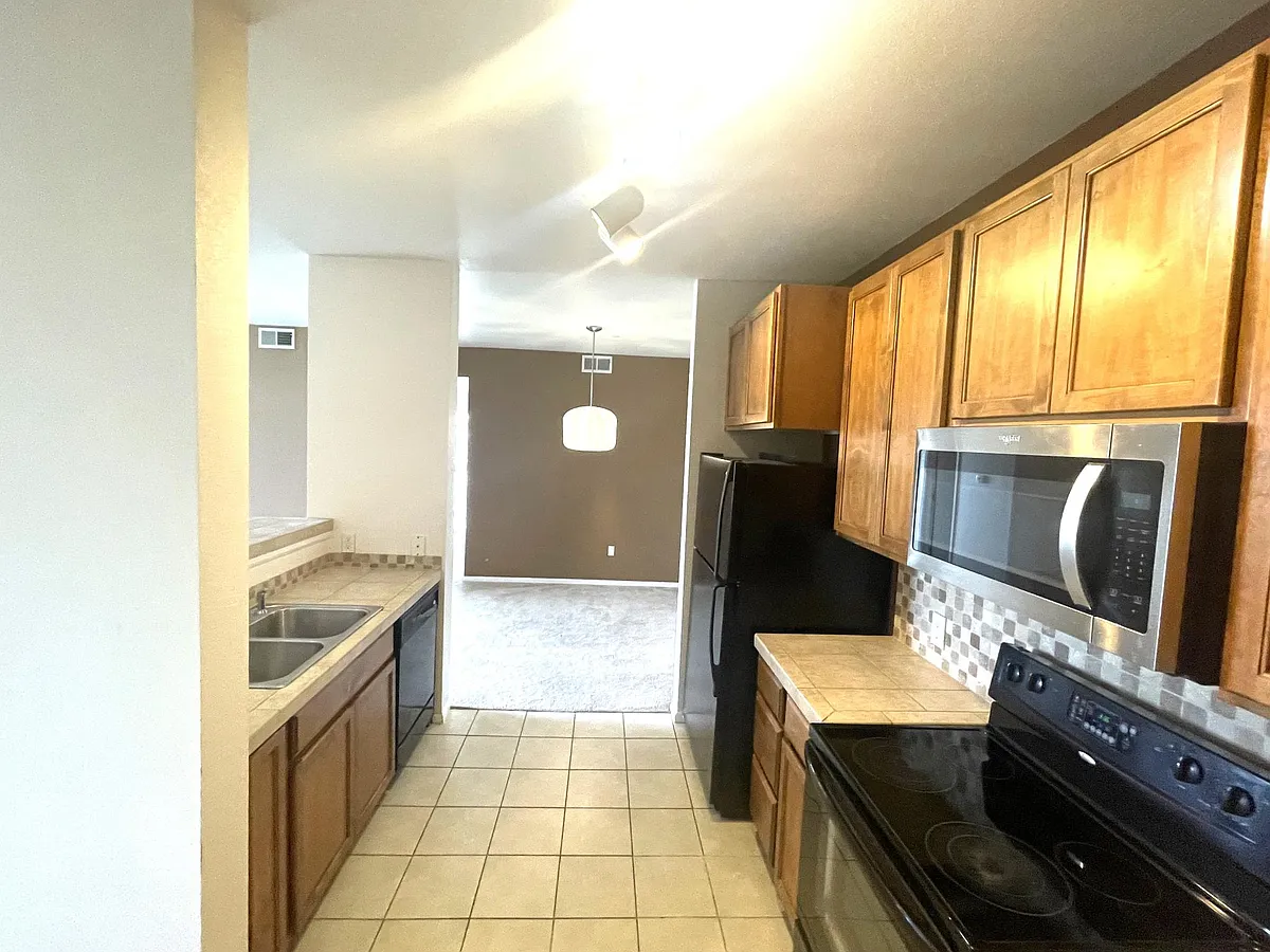open kitchen with dining area - 3890 S Dayton St #208