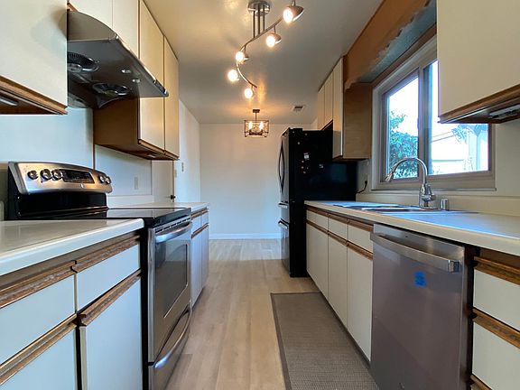 Newly renovated kitchen floor that comes with dishwasher and refrigerator