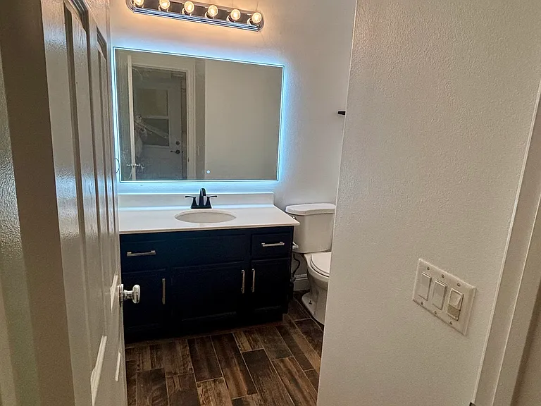 Bathroom entrance, new light up mirror.