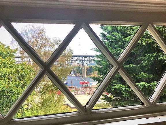 Original lattice transom windows in living room.