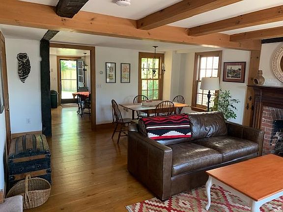 Living/dining/ looking through kitchen to back yard