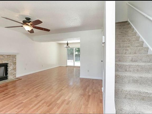From front door. Stair on the right, open living room area on left.