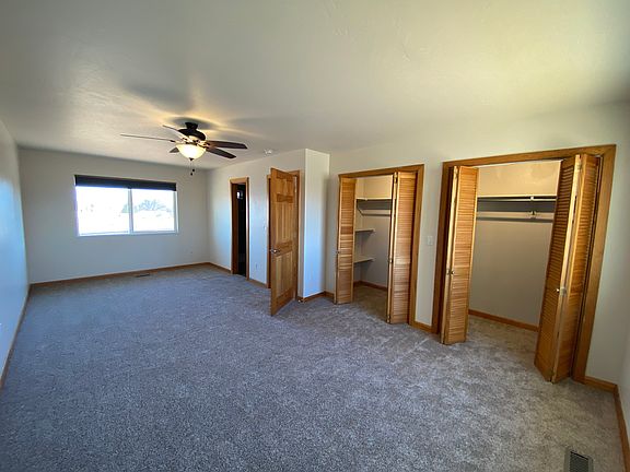Spacious primary suite with attached bathroom, great natural light, and plenty of room to create your own retreat.
