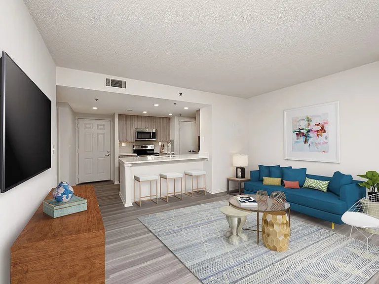 Renovated Package II kitchen, living, and dining areas with hard surface flooring