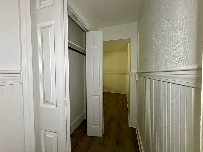 Hallway w/ Closet Connecting Bedroom Area w/ Kitchen Area