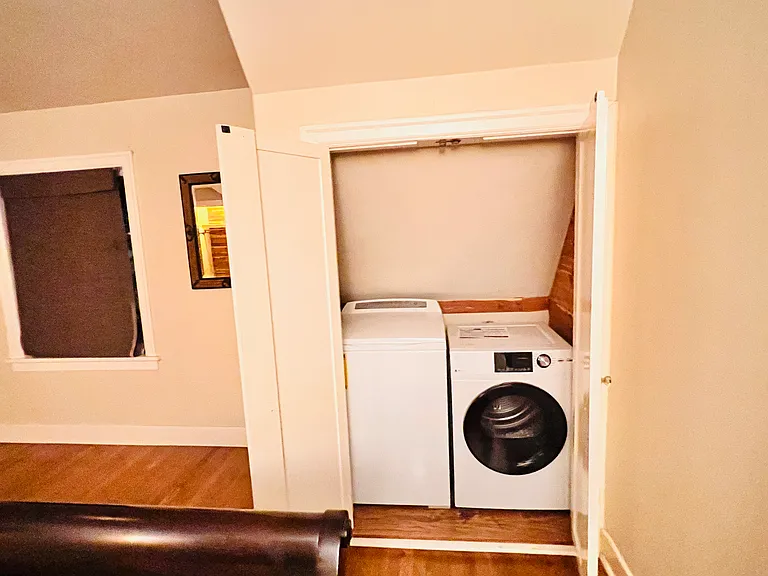 Washer/Dryer located in the master bedroom hidden behind the doors.