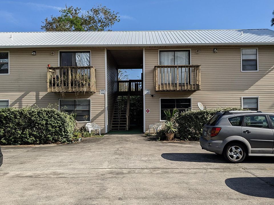 The Apartment Building and Parking Lot