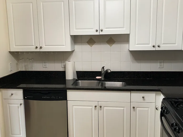 Kitchen with granite countertop and stainless steel appliances