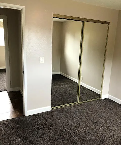 This is the second bedroom which is the last door on the right. Both the first and second bedrooms are approximately the same size.
