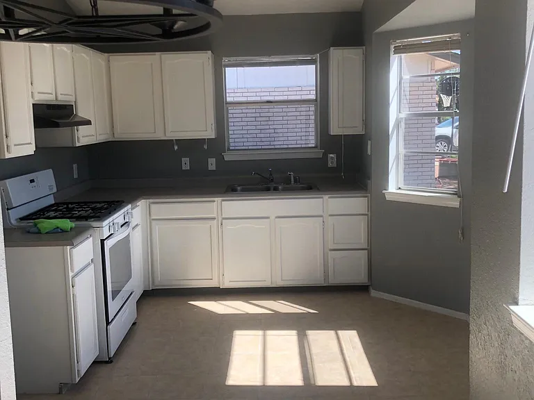 The kitchen has a new gas stove and new refrigerator, will also have new 2 inch wood blinds...