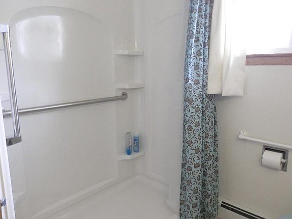 Handy walk-in shower offered in this full 3 piece bath