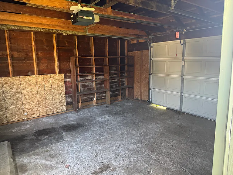 Unfinished detached garage is accessed off alleyway.