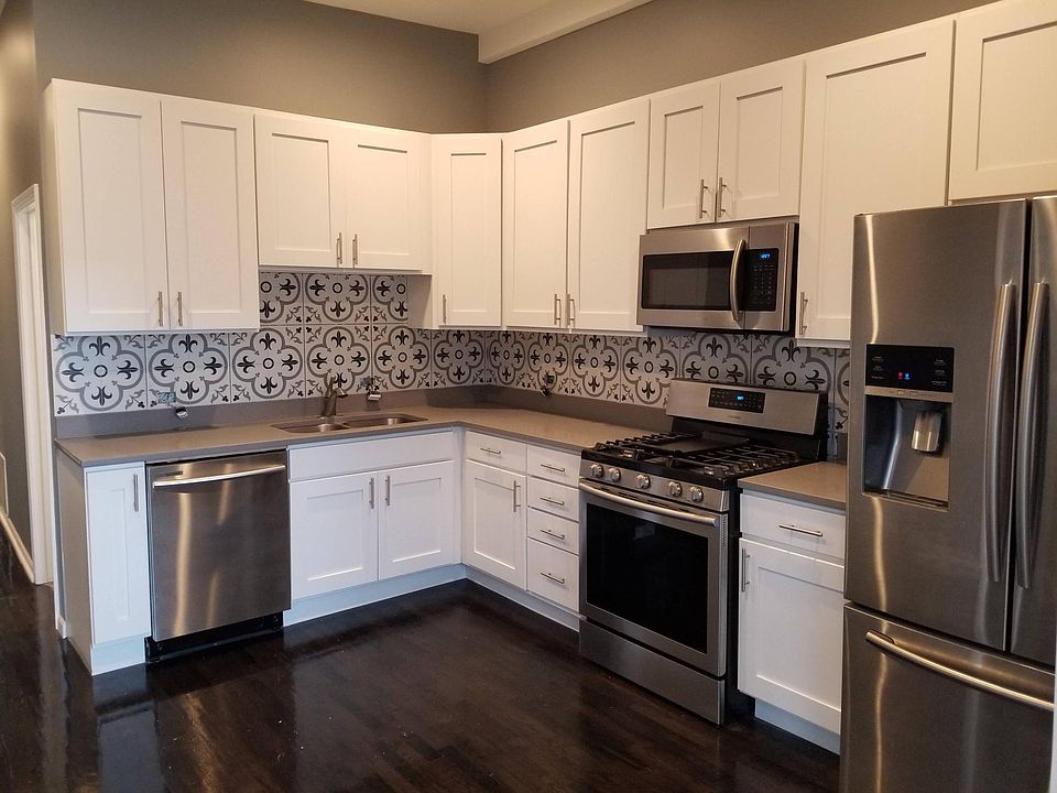 Wonderful Samsung appliances, including French door refrigerator, convection oven with griddle, microwave, and dishwasher