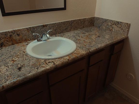 Vanity area with granite