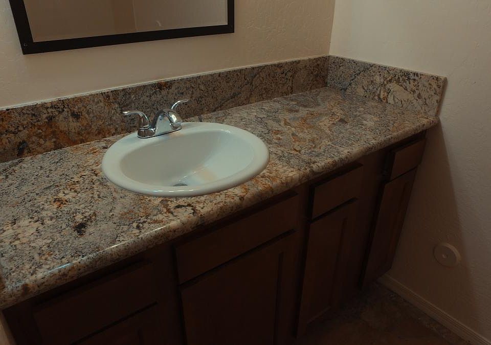 Vanity area with granite