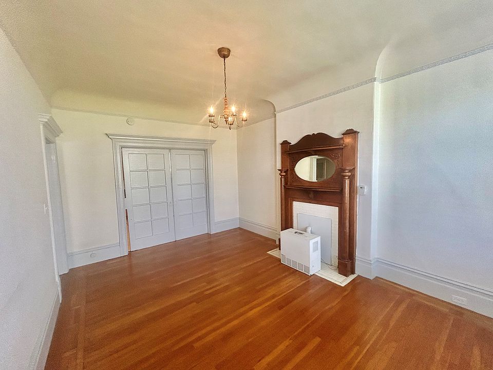 living room with doors to kitchen closed