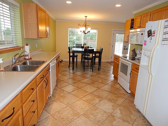 Kitchen with eating area and tile flooring