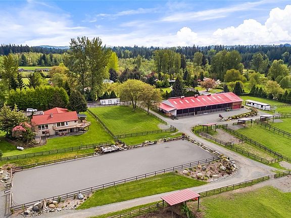 70'x200' outdoor arena with footing by Efficient Arena. Nothing compares to riding with mountain views!
