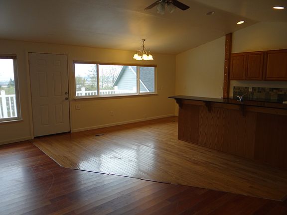 large window obverlooking deck, backyard & Puget Sound