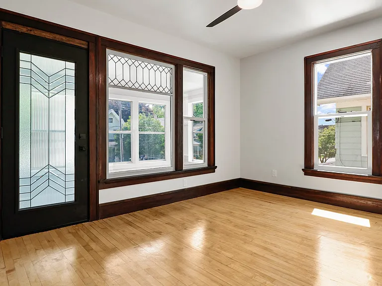 This is the top floor living space which opens into a top closed in porch. Look at that BEAUTIFUL GLASS!! LOVELY