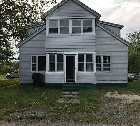 Front of house showing both apartments, up and down