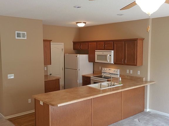 SS appliances in kitchen.