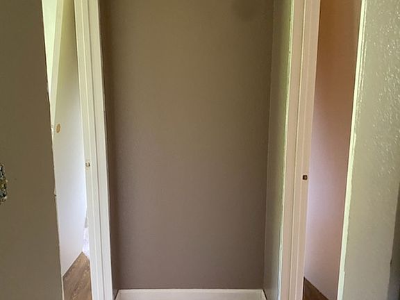 Hallway with fresh paint and laminate flooring