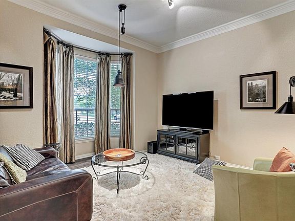 French doors provide a private office/study or could be a convenient play room for the kiddos.