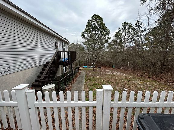 From driveway, down walkway, to unit entrance.