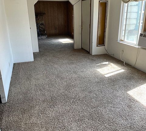 Formal Living area just inside the front door. Large space with lots of natural light. Currently, this room is furnished.