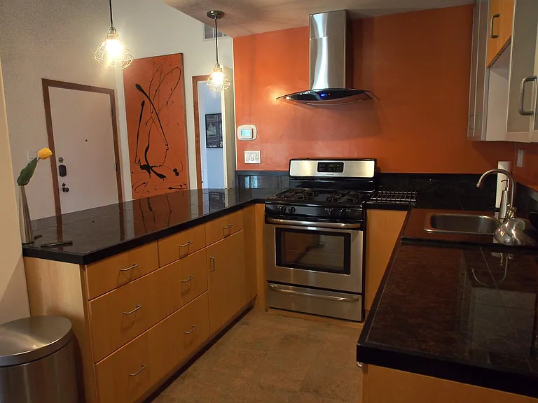 Kitchen and view of front door.