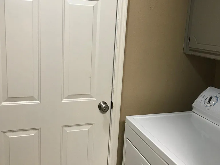 Laundry off kitchen with washer and dryer