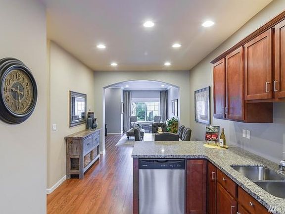 Kitchen with granite counter top with eating space. Laminate