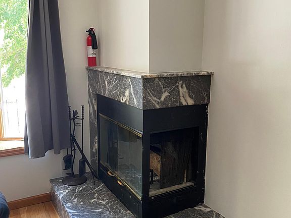 Wood burning fire place in living room.