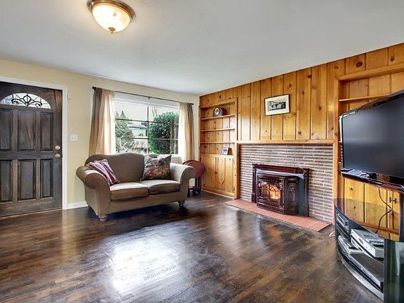 Gleaming hardwood floors, new doors and built in book cases.