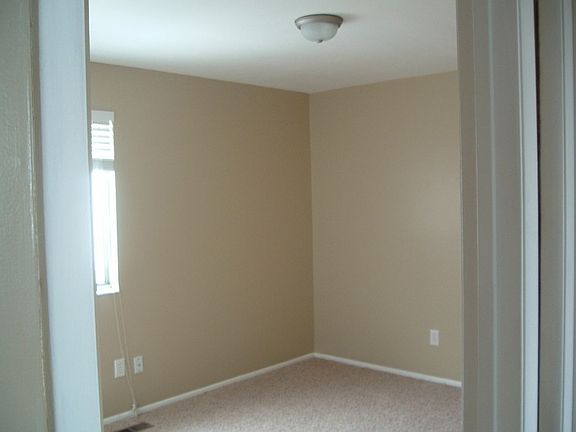 One of the 4 bedrooms which boasts new paint and carpet