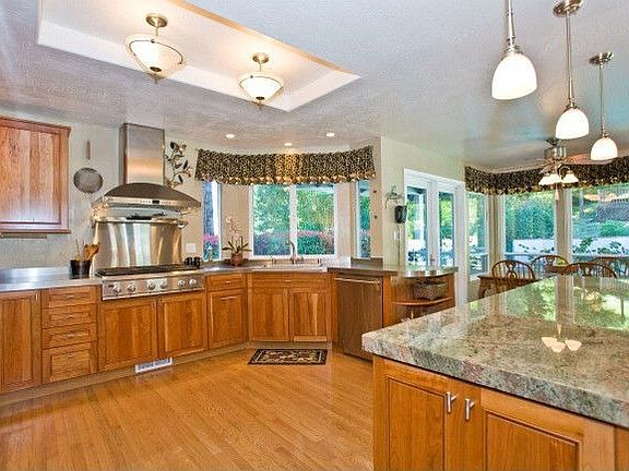 Top of the line GE Monogram stainless appliances and hansome granite island.