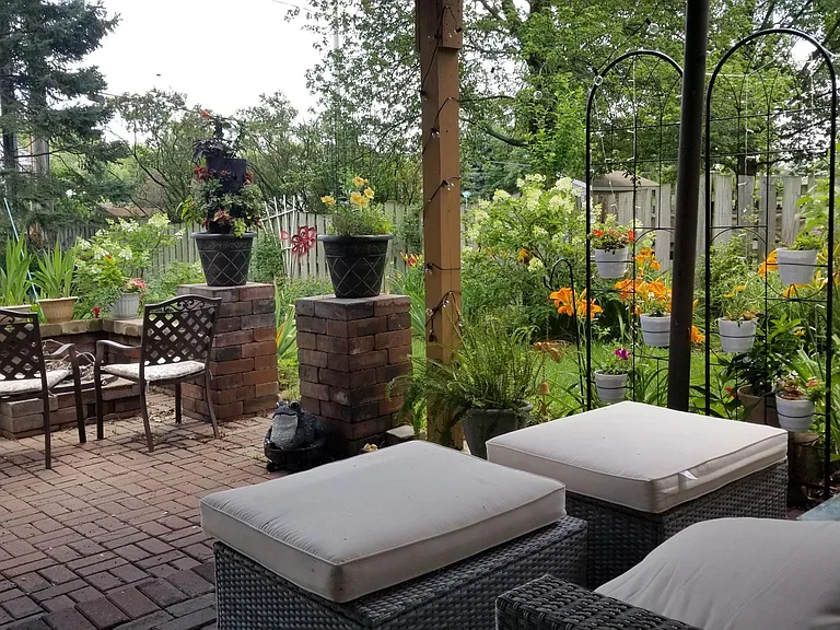 Beautiful landscaping and brick paver patio.