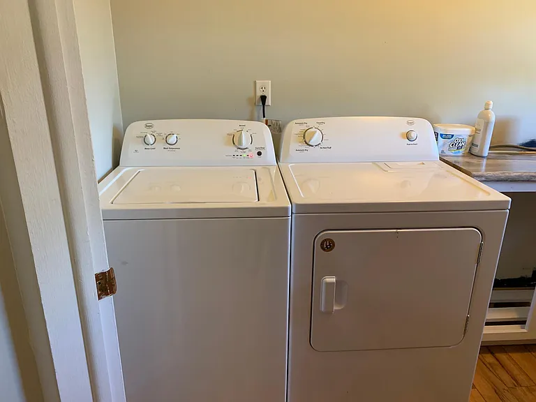 Full washer and dryer in half bath off kitchen