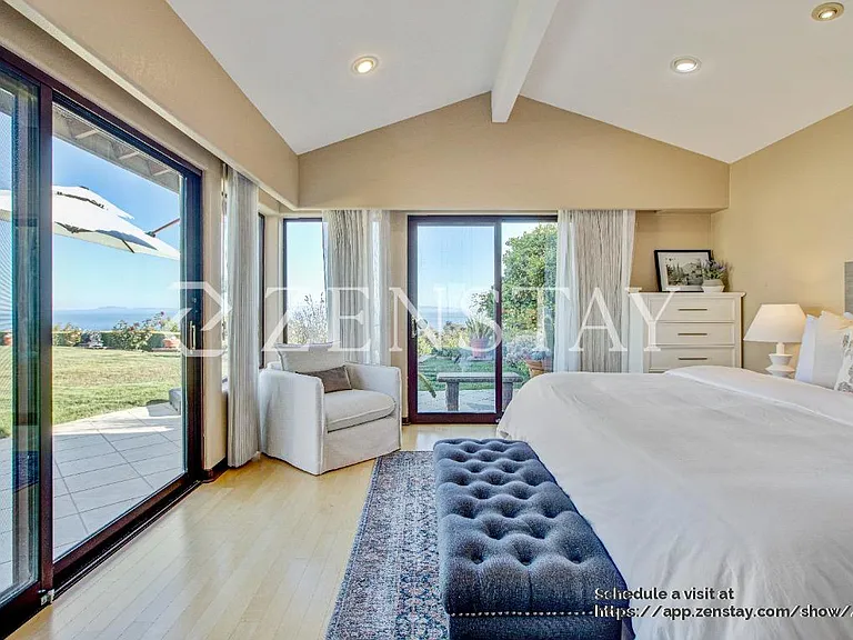 pacious primary bedroom with king bed and serene ambiance