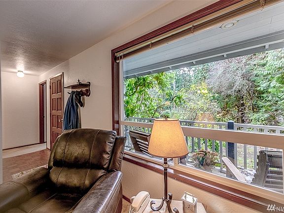 Hardwood parquet flooring entry way with convenient hallway closet leads into the Living area.   