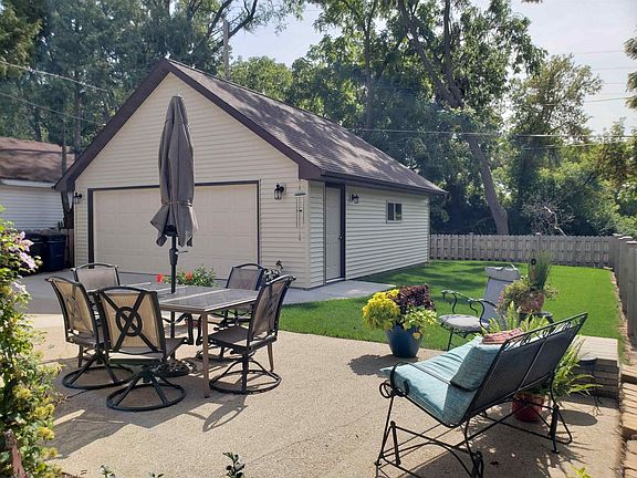 Patio area and partially fenced yard